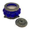 Deep blue glass jar indian scented candle in antique style with ornate silver lid featuring nag champa scent
