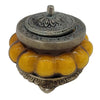 Ornate silver toned metal incense burner with amber glass segments in an antique style glass jar for precious sandal scent