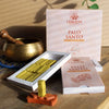 A pale yellowish green palo santo incense smudge brick neatly arranged in a white ishom box with matching packaging