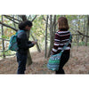 Green and teal jacquard student bag with geometric patterns made of woven fabric for everyday use
