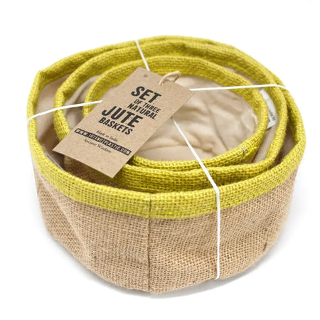 Set of three natural jute baskets with olive green rims and beige interiors neatly coiled together