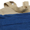Beige and navy blue cotton mesh bag with woven fabric handles made of jute and cotton in denim style