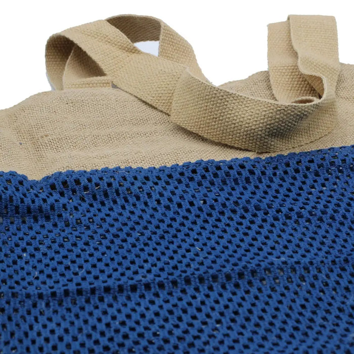 Beige and navy blue cotton mesh bag with woven fabric handles made of jute and cotton in denim style