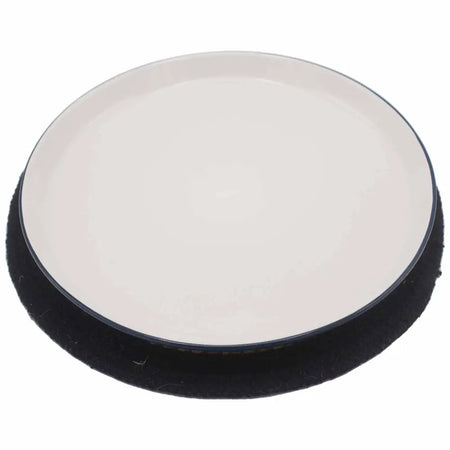 Black and white circular car detailing pad with soft textured edge shown on jute and cotton place mat black