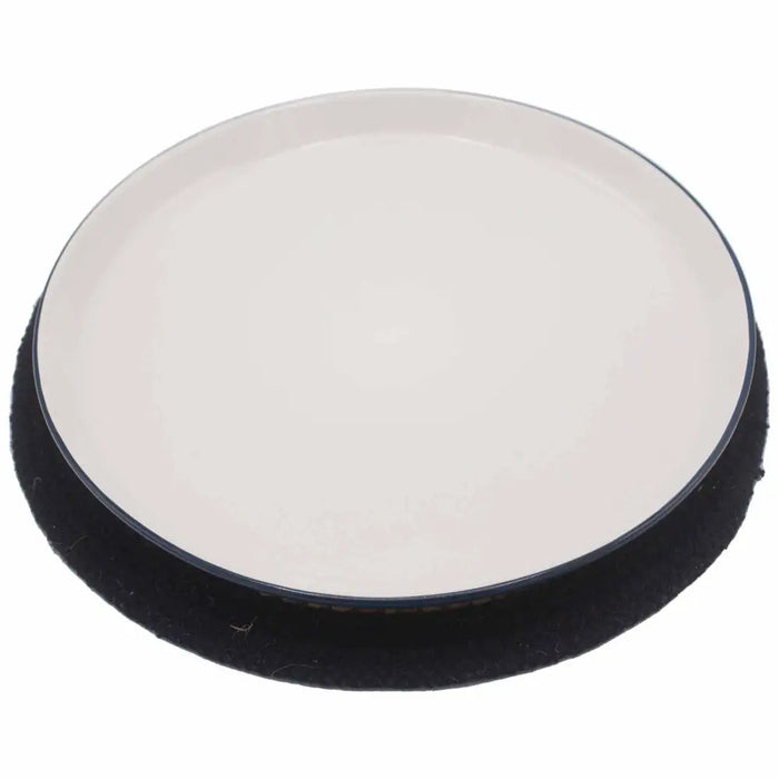 Black and white circular car detailing pad with soft textured edge shown on jute and cotton place mat black