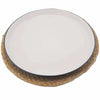 White ceramic plate with navy rim on a woven jute place mat with mandala design