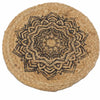 Circular woven jute coaster with a detailed black mandala design for natural textured decor use