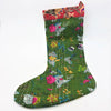 A vibrant green kantha stitched christmas stocking with colorful floral patterns and a red embroidered cuff