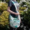 A teal and white woven shoulder bag with geometric patterns in the kathmandu big midday collection