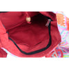 Red cotton kathmandu big drawstring bag with wooden toggle and black zipper lining called sunrise