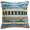 A light blue kilim cushion cover with orange green black and cream geometric patterns for standard cushions
