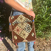 Brown woven kilim summer messenger bag with cream black terracotta geometric patterns tassels and blue red beads