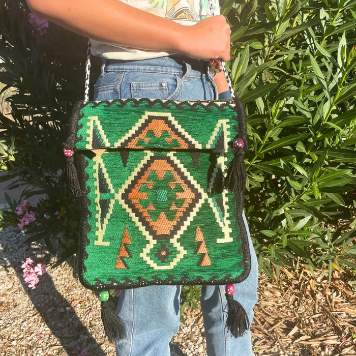 Green kilim summer messenger bag with orange cream geometric designs black tassels and pink bead accents