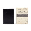 Black rectangular bar of klay soap with activated charcoal, exfoliating cranberry seeds, and bergamot sandalwood scent