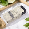 A rectangular beige and black box of ancient wisdom klay soap with fuller s earth and activated charcoal illustrations