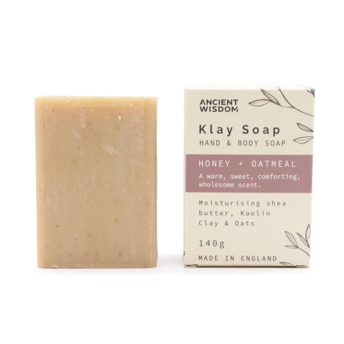 A beige rectangular bar of klay soap with honey oatmeal and kaolin clay ingredients for gentle cleansing