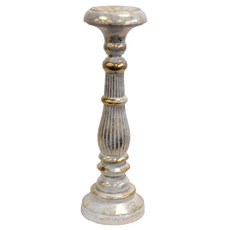 Large albasia wood candle stand in white with distressed silver and gold accents on its fluted columns