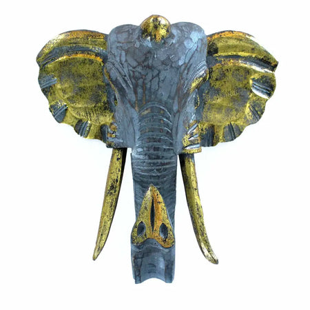 Large albasia wood elephant head wall decor with distressed gray finish and gold accents on ears tusks and forehead