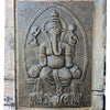 Dark gray textured concrete large antique gold ganesha relief depicting ganesha seated within an arched frame