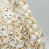 Large boho cut art shell lamp with creamy white textured spiral shells in a round 30cm design