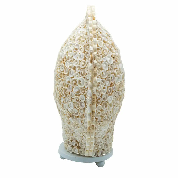 Large boho cut art shell lamp round 30cm with cream-colored spiraled seashells arranged in an oval shape