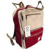 Large boxy hemp backpack in wine and cream with two-toned herringbone pattern and brown zippers and straps made from hemp materials