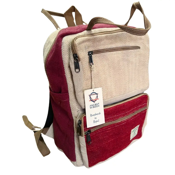 Large boxy hemp backpack in wine and cream with two-toned herringbone pattern and brown zippers and straps made from hemp materials