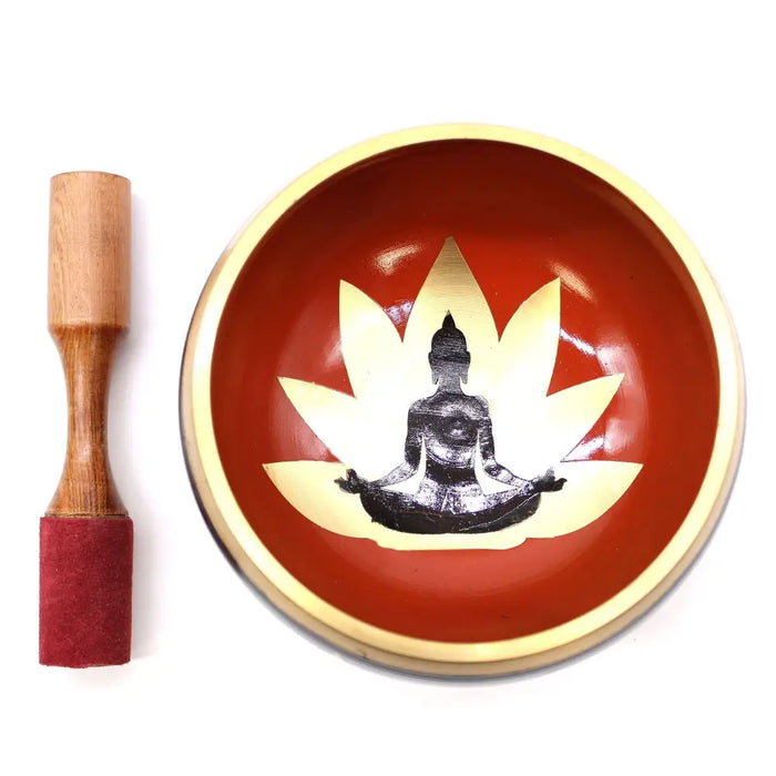Large red and gold singing bowl set with a black buddha silhouette seated on a lotus flower in black and orange tones