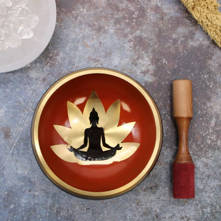 Large buddha singing bowl set with red singing bowl featuring gold rim lotus design and black meditating figure silhouette