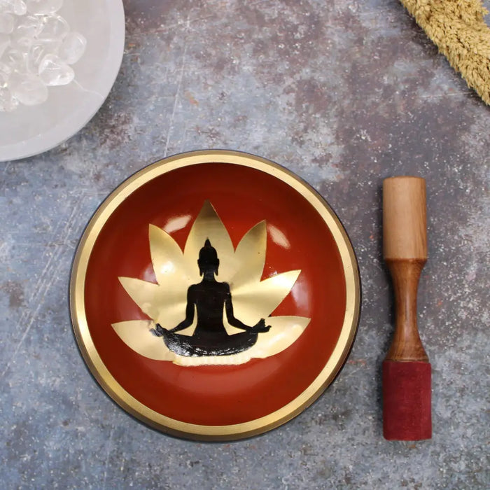 Large buddha singing bowl set with red singing bowl featuring gold rim lotus design and black meditating figure silhouette
