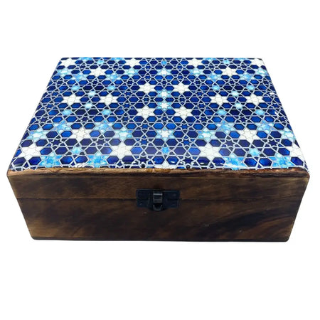 A large ceramic glazed wooden box with a mosaic lid featuring blue and white star patterns and geometric design