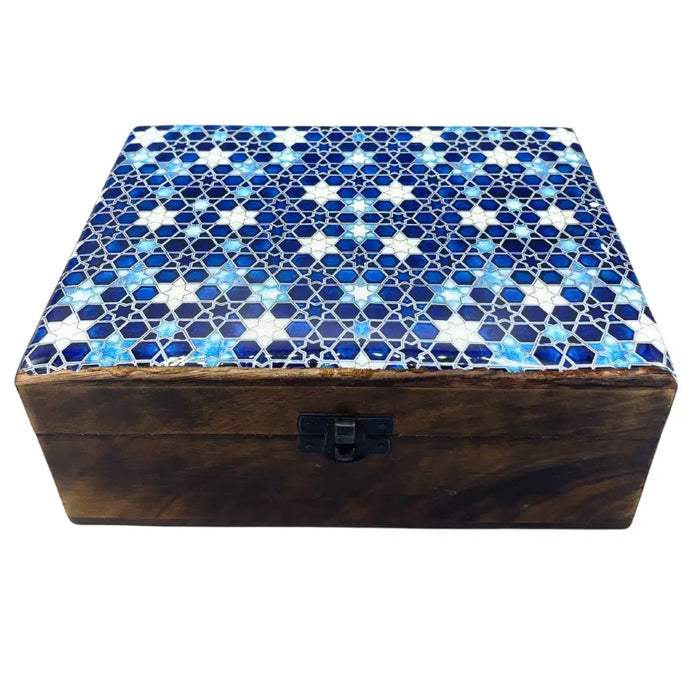 A large ceramic glazed wooden box with a mosaic lid featuring blue and white star patterns and geometric design