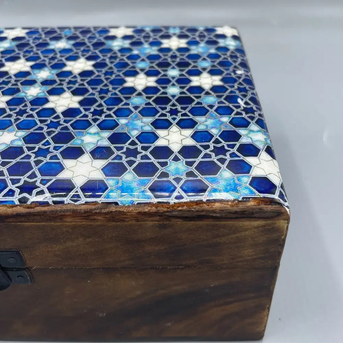 Large ceramic glazed wooden box with blue and white geometric mosaic pattern on the lid