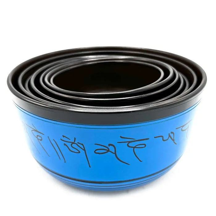 Blue tibetan singing bowl with black rim and inscribed mantras from large chakra set of seven singing bowls
