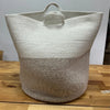 Large cotton rope laundry basket with two-toned texture white upper half and beige lower half with handles