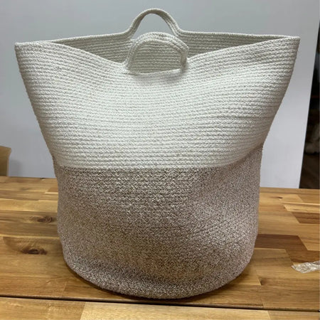 Large cotton rope laundry basket with two-toned texture white upper half and beige lower half with handles
