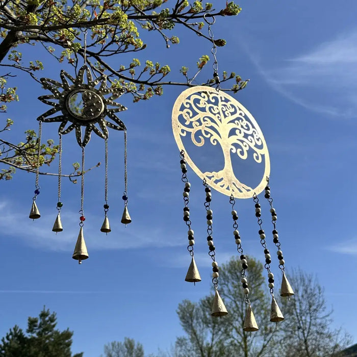 Large indian brass chimes in gold with tree of life and sun designs featuring five dangling bells and beads