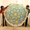 Large mandala roundy art beach towel in blue yellow and green with fringed edges made of soft fabric
