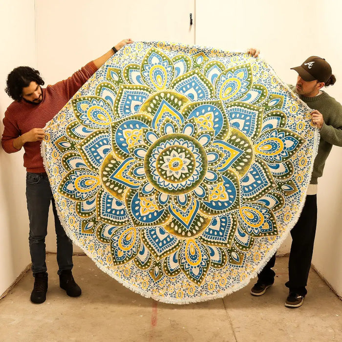 Large mandala roundy art beach towel in blue yellow and green with fringed edges made of soft fabric
