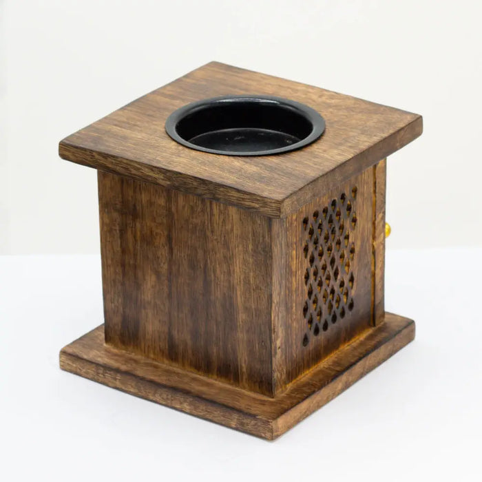 Dark brown mango wood large incense burner with black circular recess and lattice cutouts shaped like an elephant