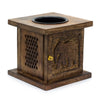 Dark brown mango wood oil burner with carved elephant design and perforated side panel for incense burning