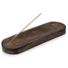 Dark brown large mango wood incense tray with smooth oval surface and rounded edges for wood incense use