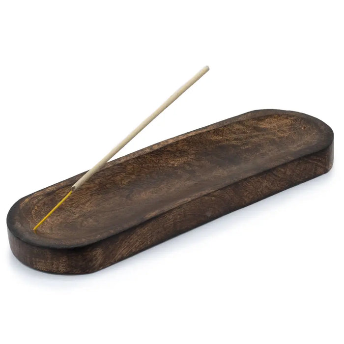 Dark brown large mango wood incense tray with smooth oval surface and rounded edges for wood incense use