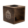Dark brown mango wood oil burner cube with carved buddha face and two black circular openings
