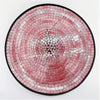 Large mosaic tile dish with circular pink and silver glittery tiles framed by a black border