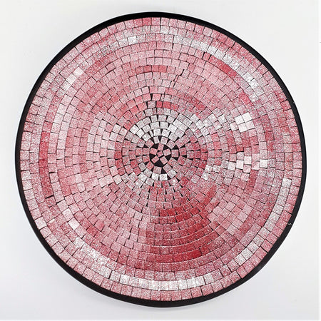 Large mosaic tile dish with circular pink and silver glittery tiles framed by a black border