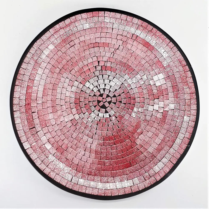 Large mosaic tile dish with circular pink and silver glittery tiles framed by a black border