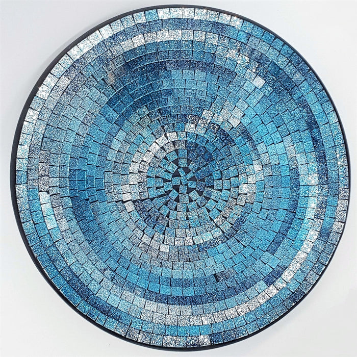 Large mosaic tile dish with circular blue and silver glittery textured tiles in concentric rings