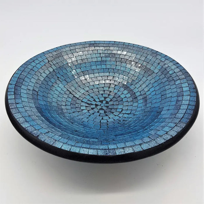 Large mosaic tile dish with a circular blue gradient pattern accented by silver and black tiles on the rim