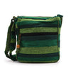 Large nepal sling bag in forest green with green stripes woven fabric and wooden toggle closure crossbody style